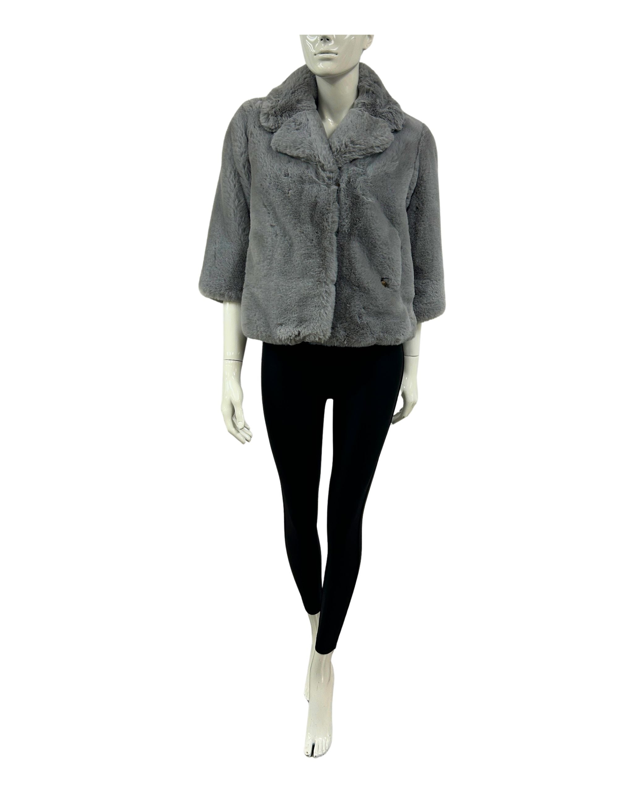 Mannequin wearing a gray faux fur jacket