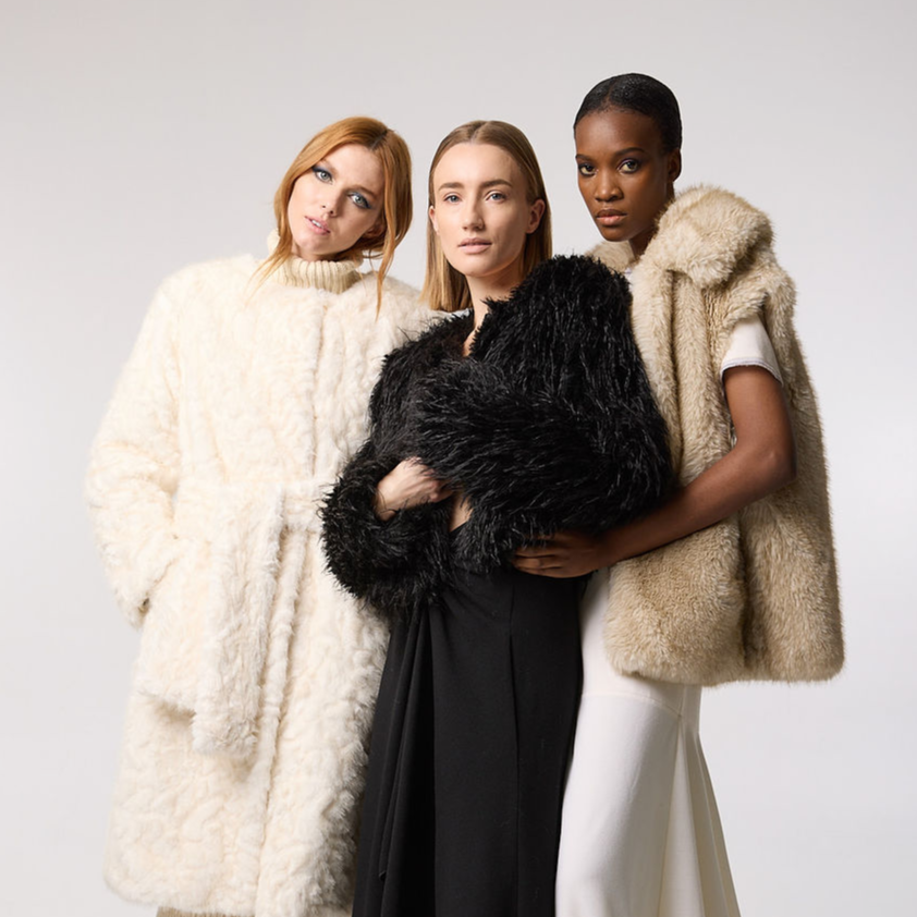 3 models, each in different faux fur FREED coats.