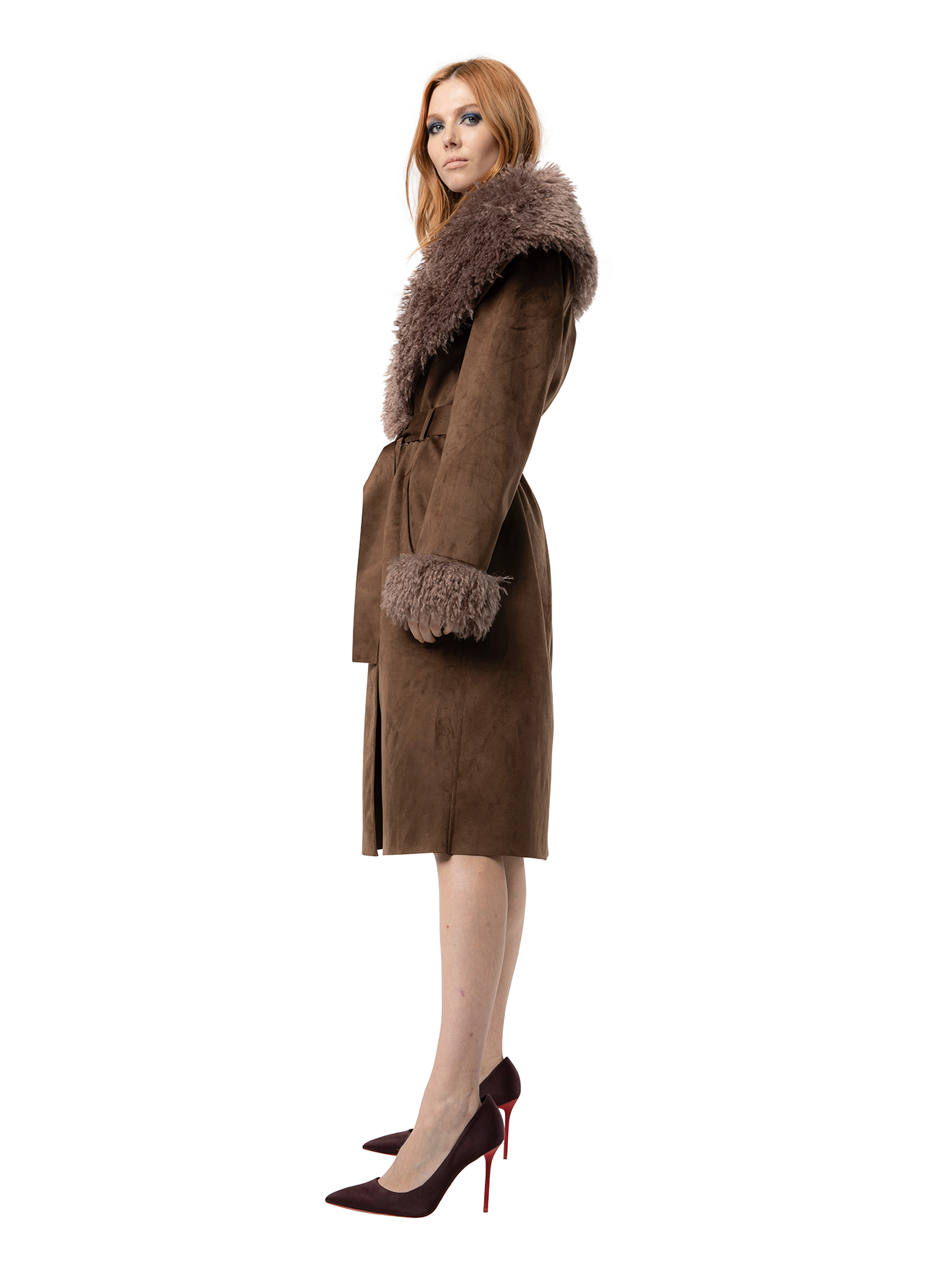 Side view — KENZIE in Pecan shown from the side, with soft draping, turn-back cuffs, and plush faux fur trim creating a bold silhouette.